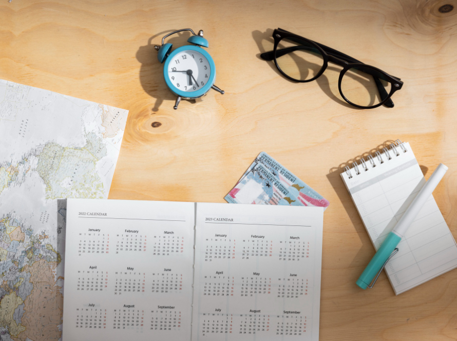 Calendar and travel items symbolizing the 2025 naturalization timeline